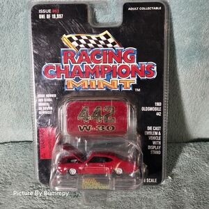 Sealed Racing Champions Mint 1969 Oldsmobile 442 W-30 diecast model car in red.